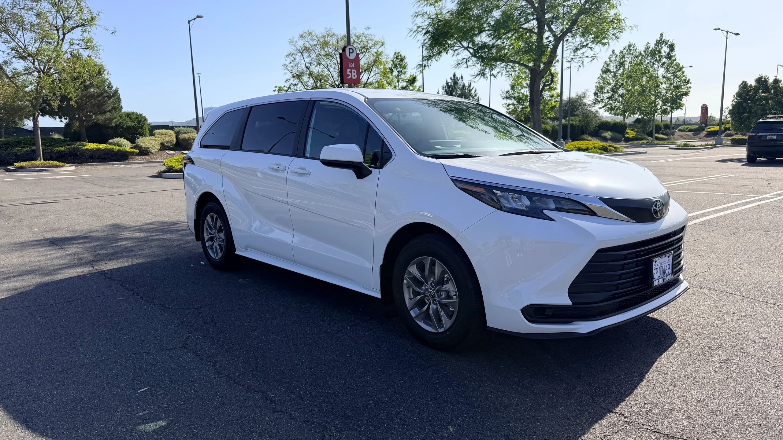 White Toyota Sienna minivan available for rental